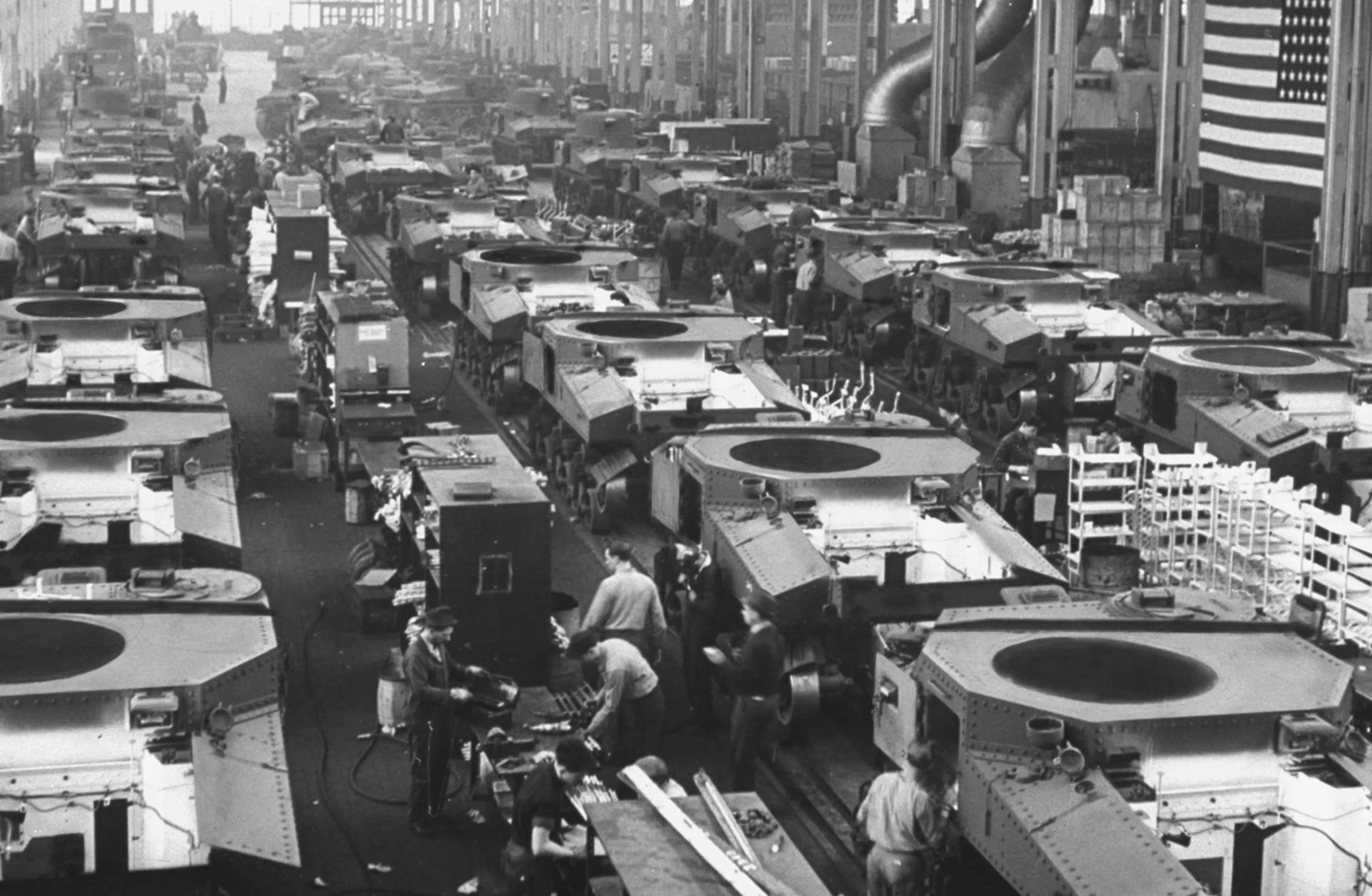 Workers assemble aircraft engines in an American factory