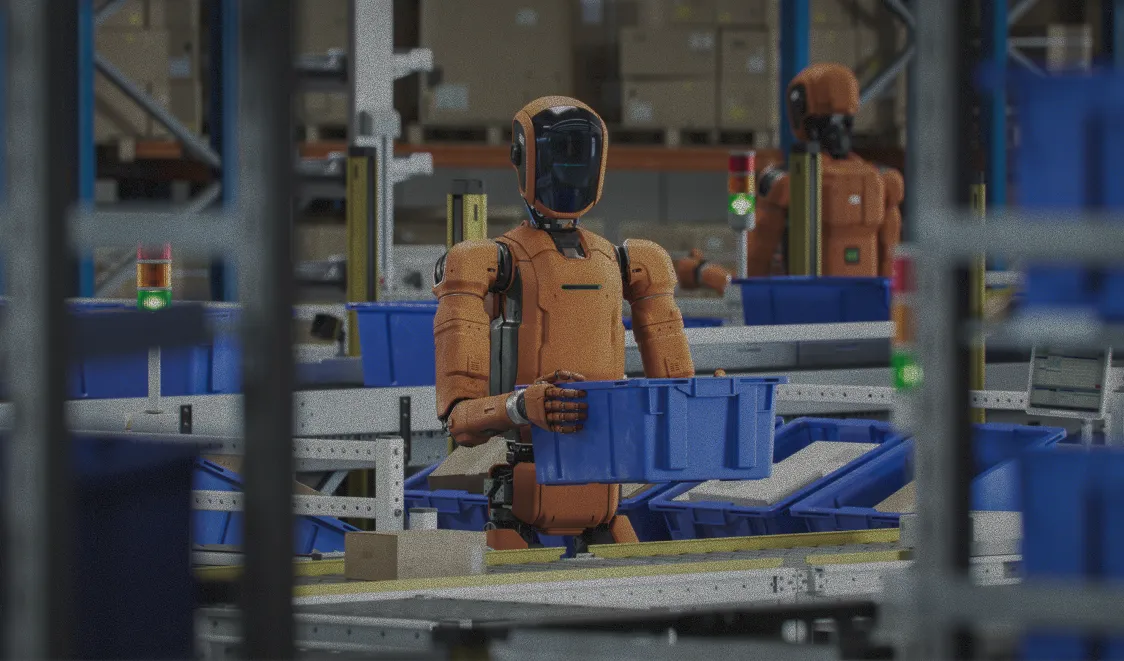 Humanoid robots move blue bins through a warehouse