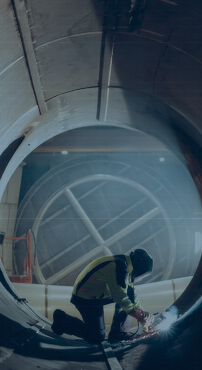 A worker inside an industrial tunnel